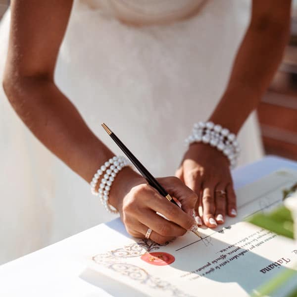 Signing wedding documents at Victoria House Resort and Spa