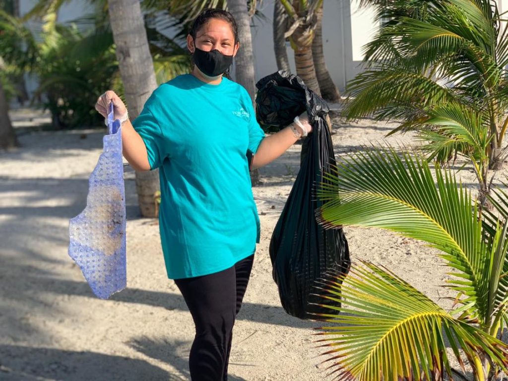 Victoria House staff holding garbage during Reef Week clean up