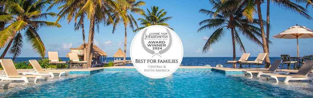 Best for Families Conde Nast Johansens banner with image of Victoria House pool and beach. 